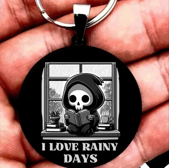 Baby reaper read Book on raining day keychain - Picture 1 of 1